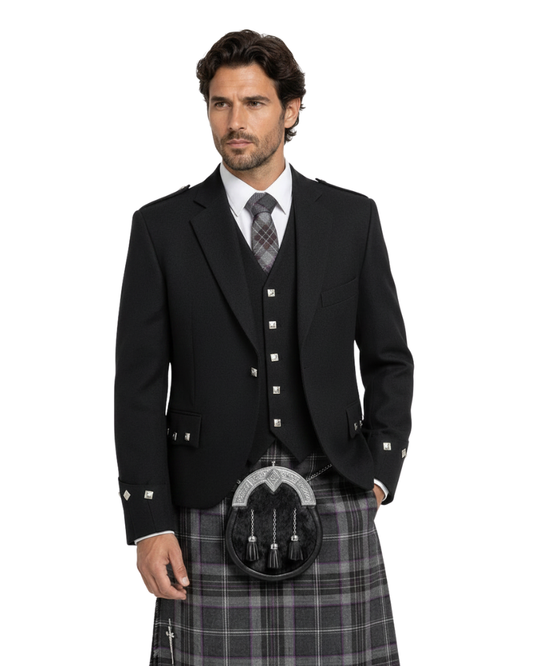 Man wearing a black traditional Scottish Argyle jacket and matching waistcoat with silver square buttons along with grey tartan kilt against a white background.