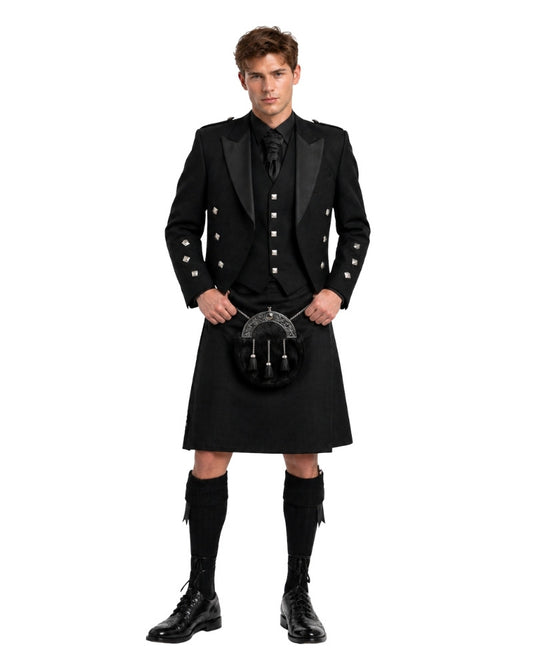 Man wearing a traditional black Scottish kilt with jacket and boots on a white background