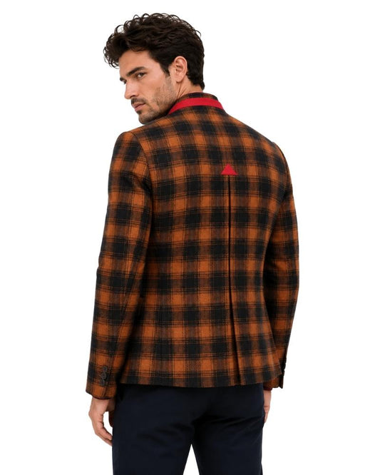 Man wearing a plaid jacket with a red accents on a white background