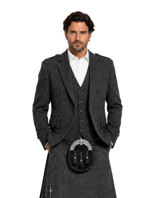 Man wearing a traditional Scottish kilt with a gray jacket on a white background