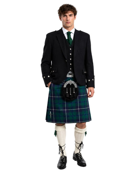 Man wearing a traditional Scottish kilt with a white background