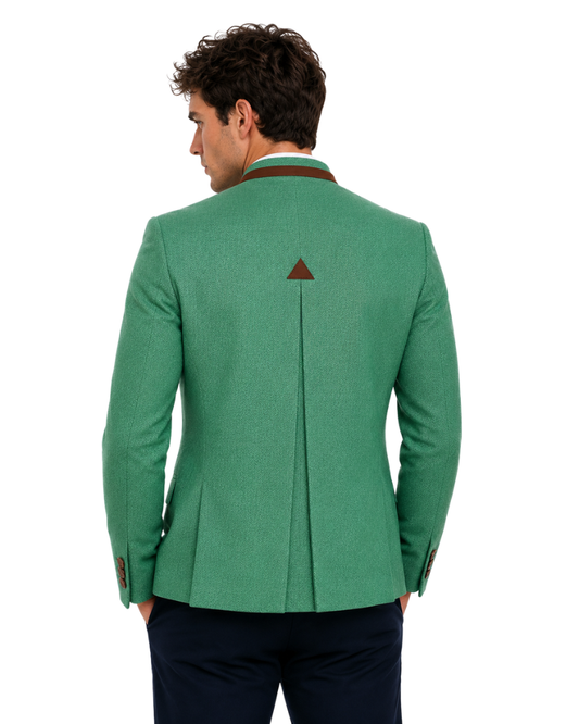 Green blazer with a triangle emblem worn by a person on a white background