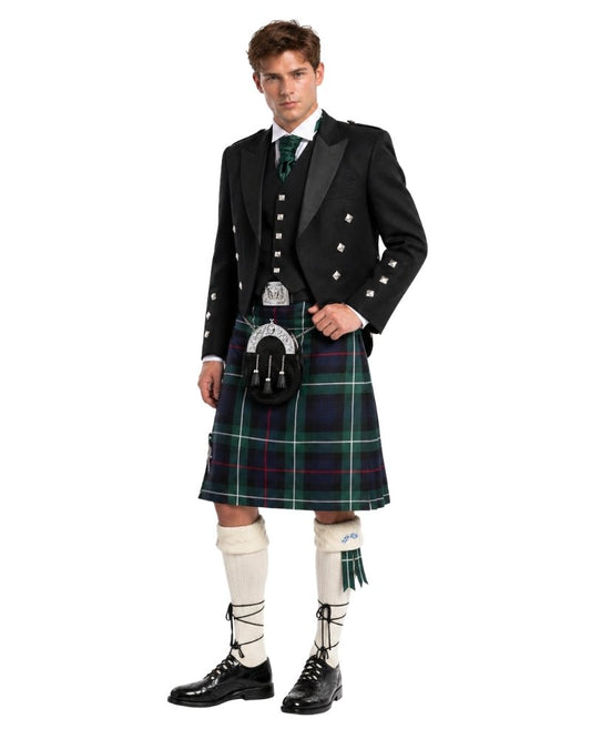 Man wearing a traditional Scottish kilt with a white background