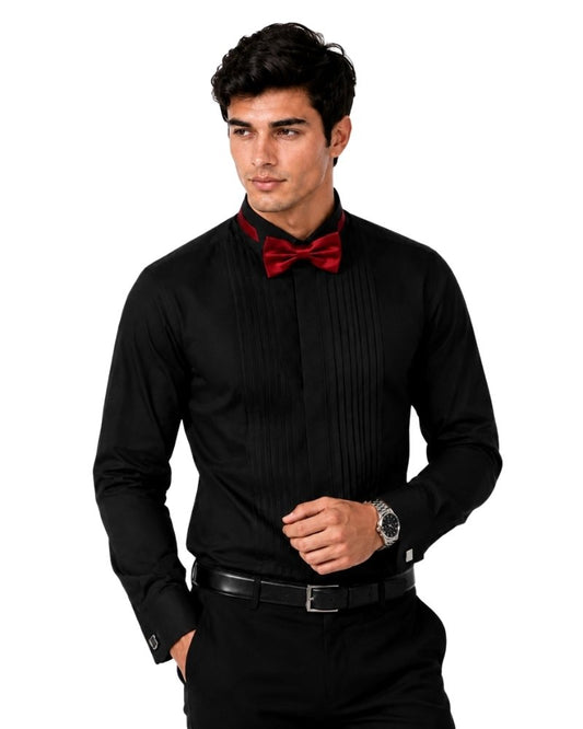 Man wearing a black dress shirt with a red bow tie on a white background