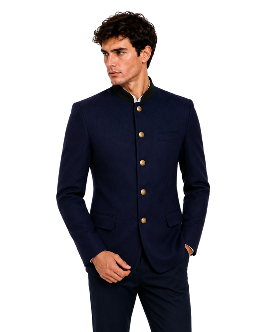 Man wearing a navy blue suit with gold buttons on a white background