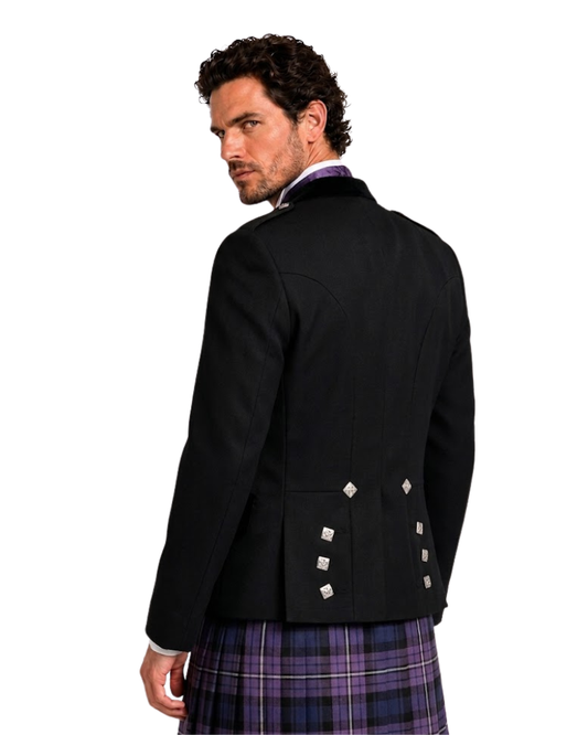 Man wearing a black jacket with tartan kilt on a white background