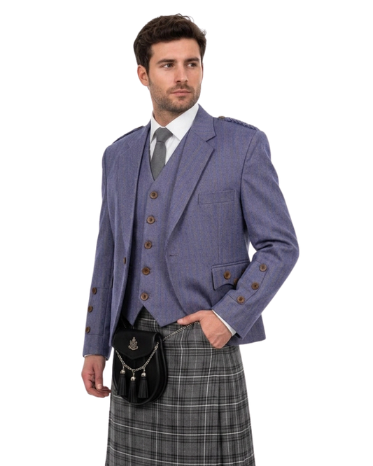 Man wearing a traditional Scottish outfit with a purple jacket, vest, and gray plaid kilt on a white background.