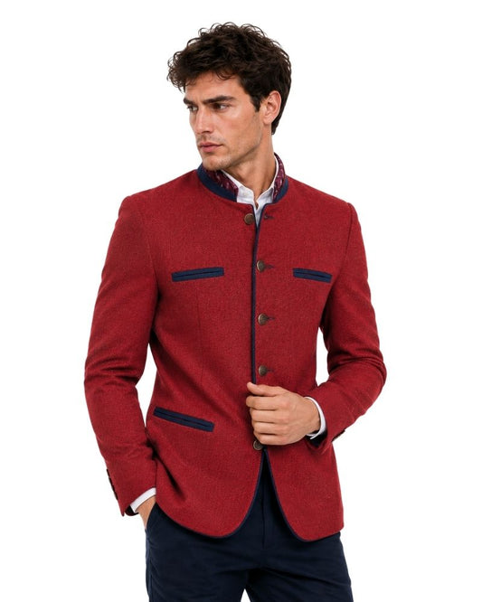A man wearing red blazer with dark blue accents on white background