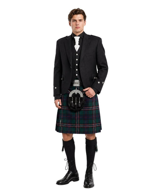 Man wearing a traditional Scottish kilt with a jacket and boots on a white background