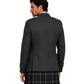Man wearing black argyle jacket with grey and black plaid kilt on a white background.