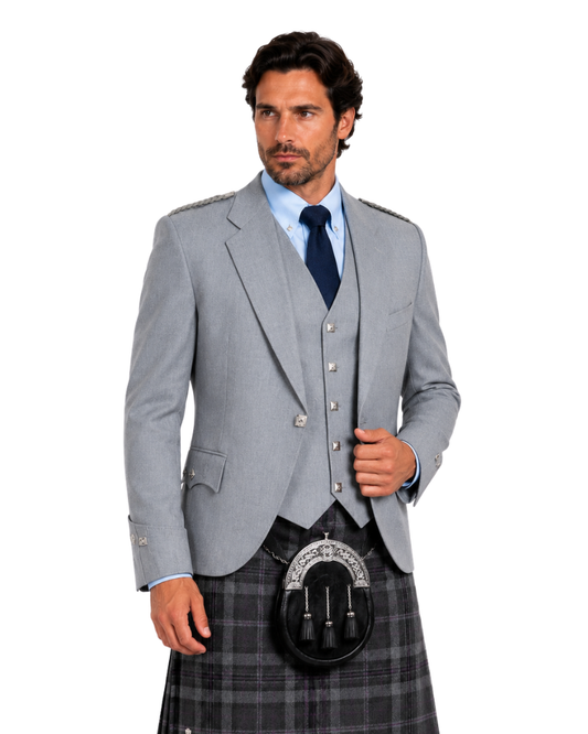 Man wearing Grey Argyle jacket with plaid kilt and black sporran against a white background.