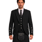 Man wearing a black argyle jacket with black kilt against a white background.