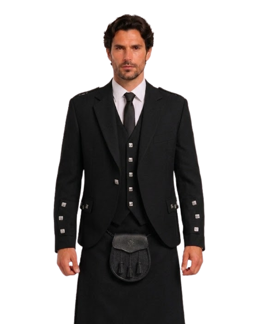 Man wearing a black argyle jacket with black kilt against a white background.