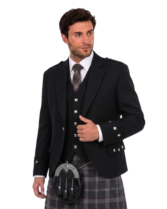 man wearing a black traditional Scottish Argyle jacket and matching waistcoat with silver square buttons along with grey tartan kilt against a white background