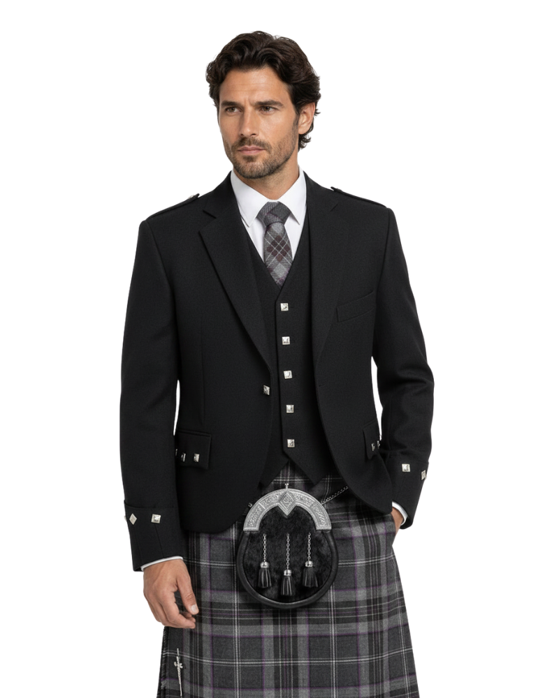 Man wearing a black Highland jacket with a kilt on a white background
