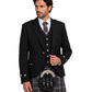 Man wearing a black Argyle Jacket with silver buttons along with grey and brown plaid kilt against white background.