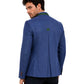 Man wearing blue blazer with green accents on white background