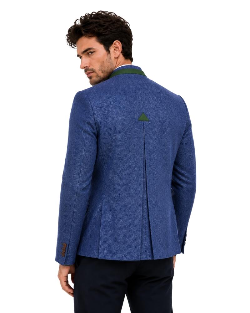 Man wearing blue blazer with green accents on white background