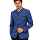 Man wearing a blue blazer with green accents on a white background