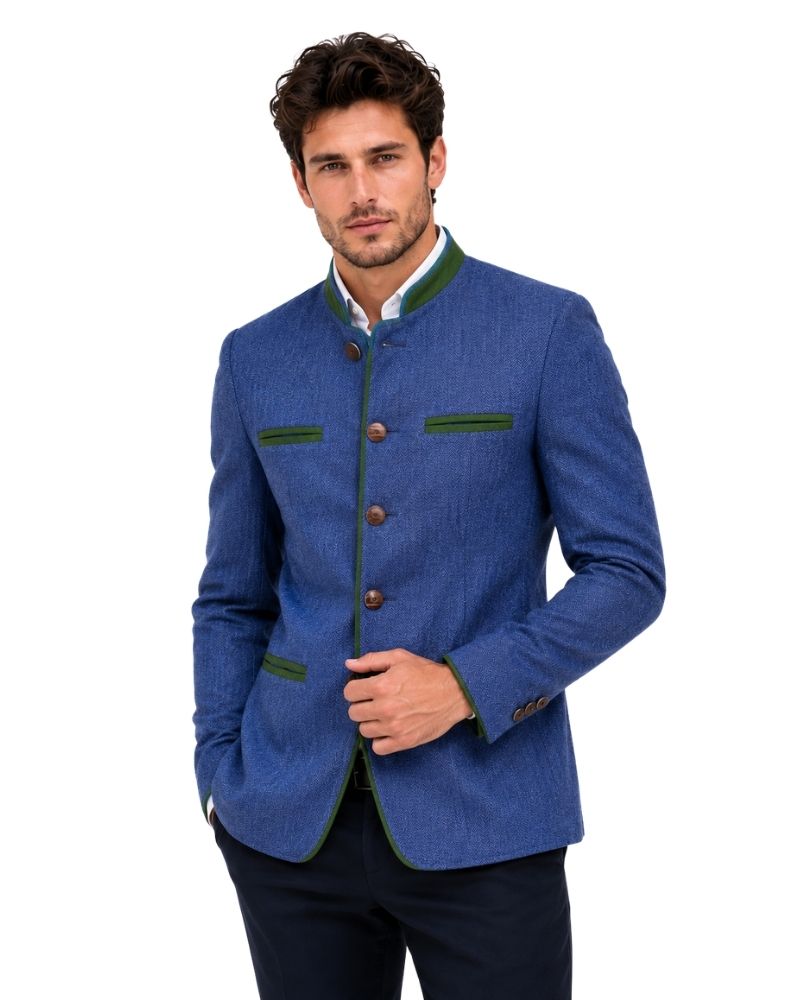 Man wearing a blue blazer with green accents on a white background