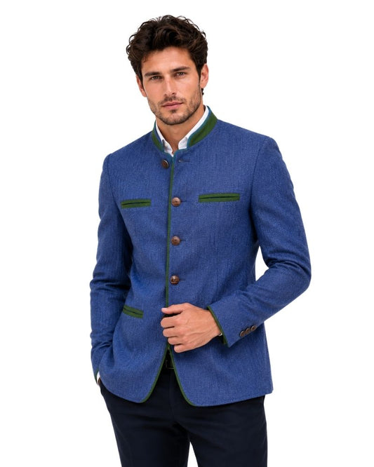 Man wearing a blue blazer with green accents on a white background