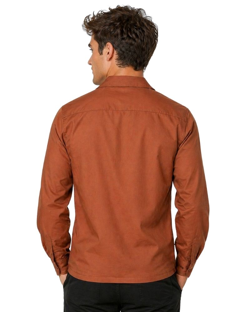 Man wearing a brown shirt on a white background