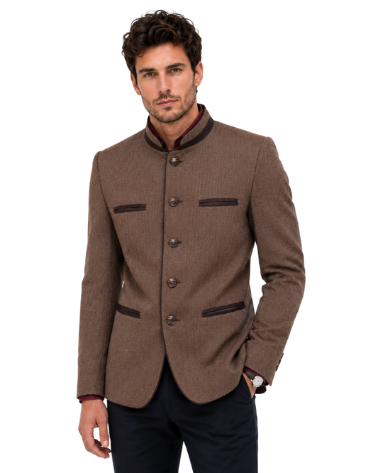 Man wearing a brown blazer with black accents on a white background