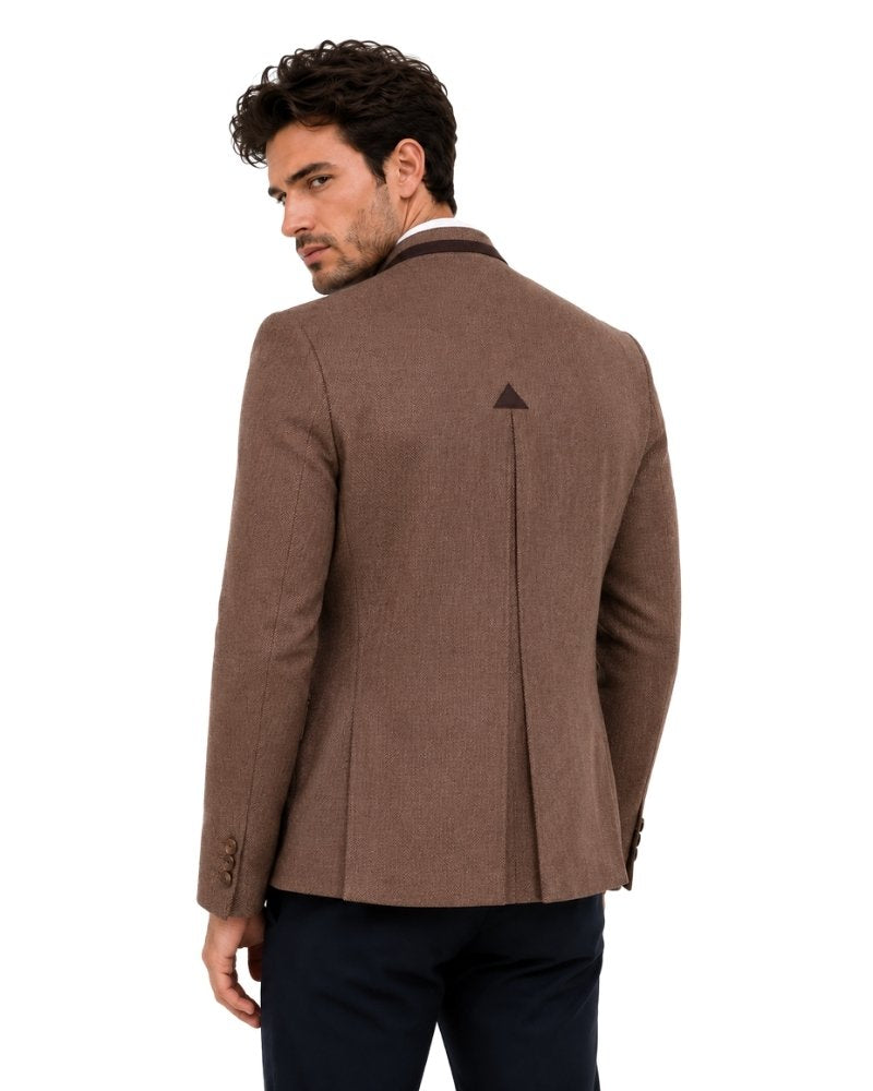 Man wearing a brown blazer on a white background 