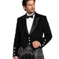 Man wearing a black tuxedo with a kilt on a white background