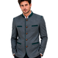 Man wearing a dark green blazer with green accents on a white background