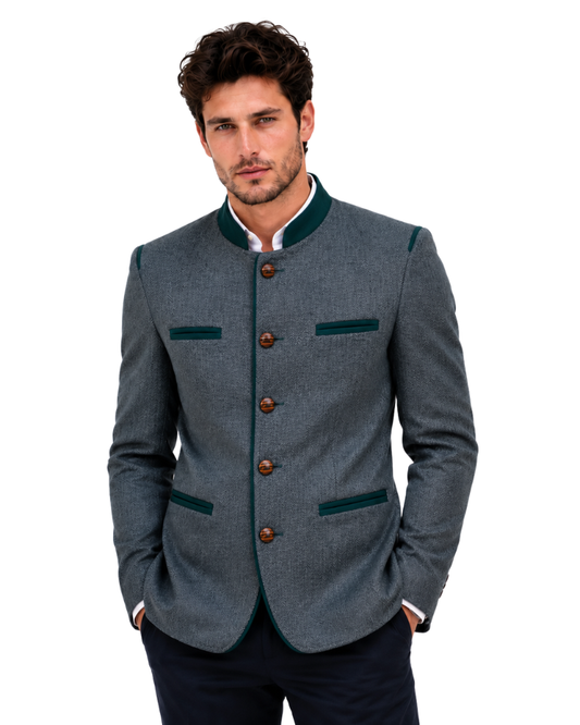 Man wearing a dark green blazer with green accents on a white background
