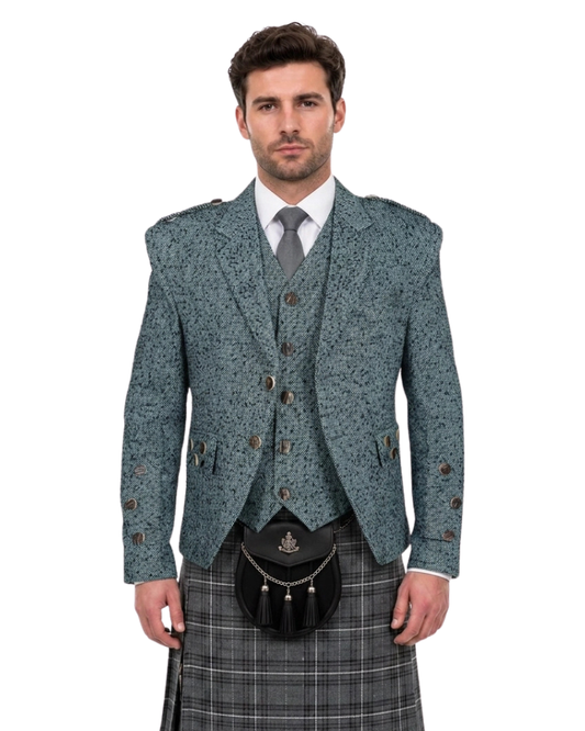 Man wearing a traditional Scottish kilt with a patterned jacket and vest on a white background