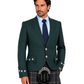 A man modeling a dark green Scottish kilt suit jacket with silver decorative buttons, paired with a gray plaid kilt, black sporran, and a light blue dress shirt with a navy tie, against a plain white background.