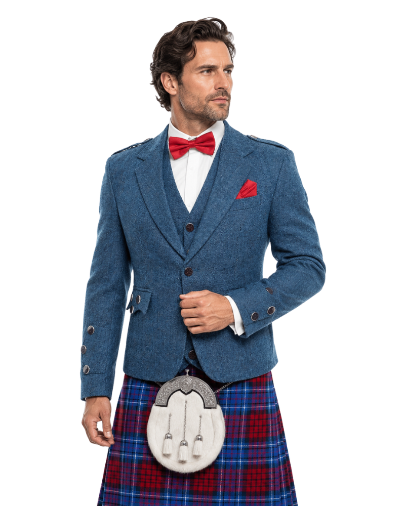 Man wearing a blue jacket, red bow tie, and plaid kilt on a white background