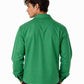 Man wearing a green long-sleeve shirt on a white background