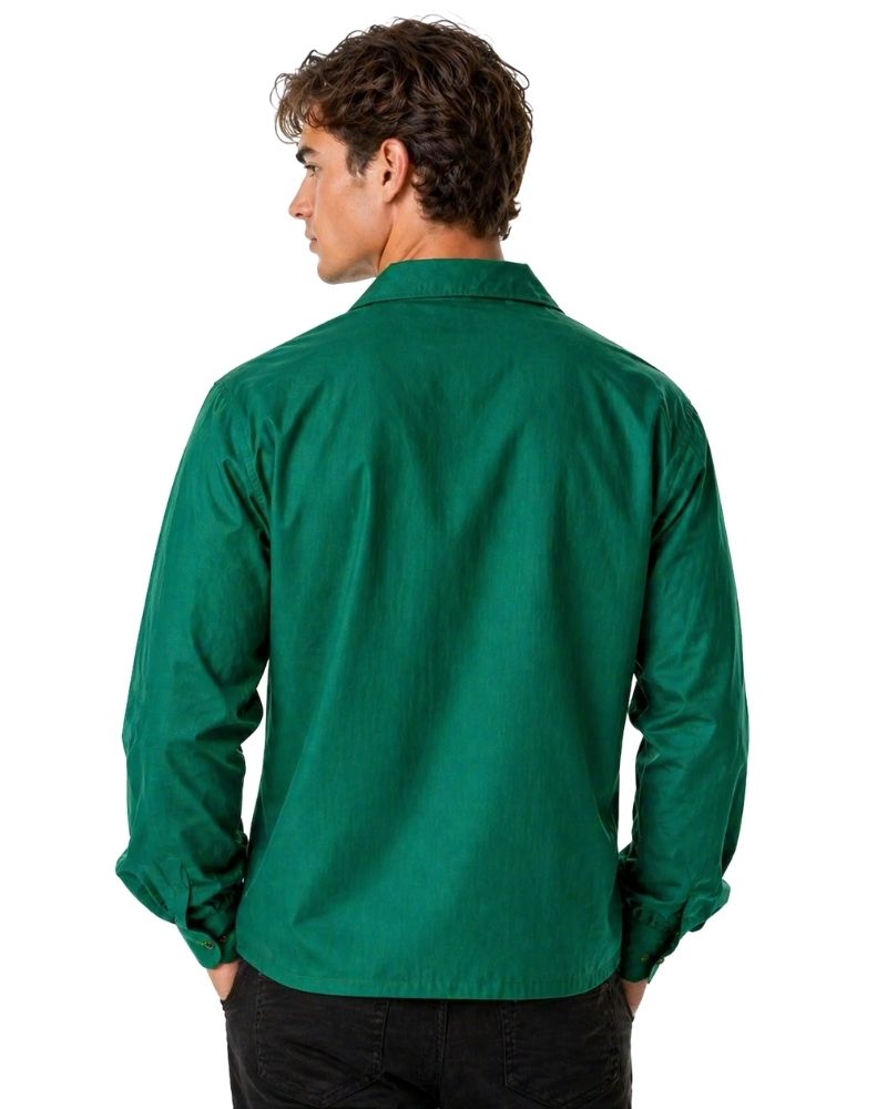 Man wearing a green shirt on a white background