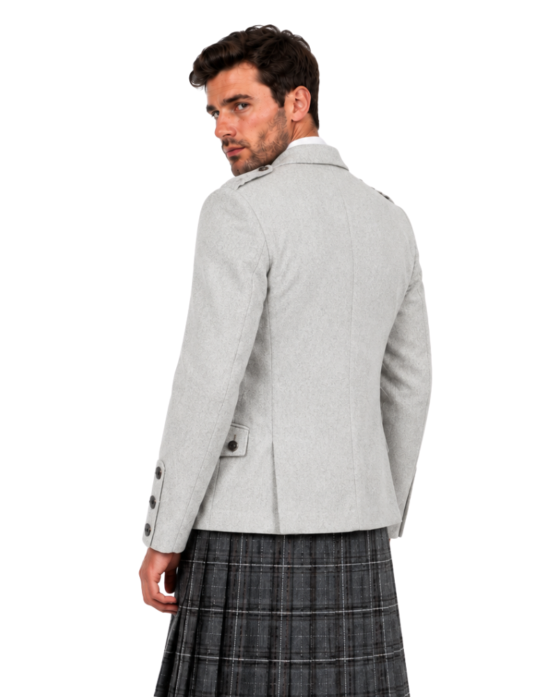 A man wearing a light gray blazer and a dark gray plaid kilt, shown from a three-quarters back view against a plain white background.