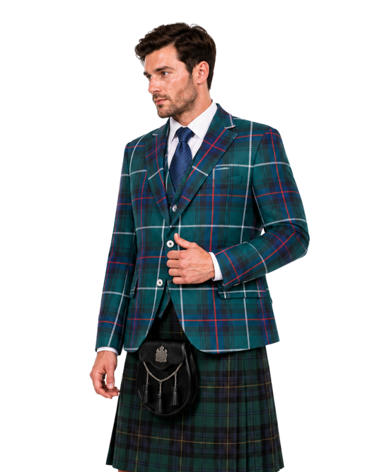 A man wearing a green tartan kilt suit with a matching blazer, tie, and black sporran, photographed against a plain white background.
