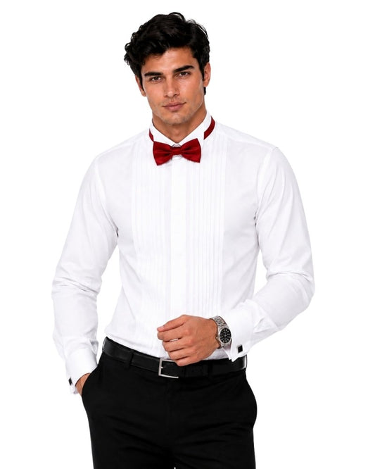 Man wearing a white dress shirt with black pants and a red bow tie on a white background