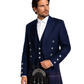 Man wearing a navy blue Highland outfit with a kilt on a white background