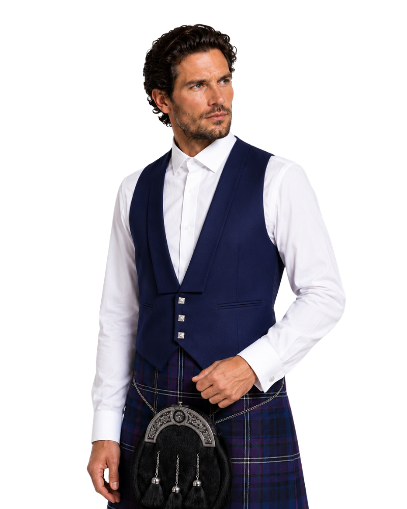 Man wearing a navy vest and plaid kilt on a white background