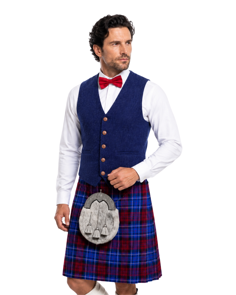 Man wearing a blue vest, white shirt, red bow tie, and tartan kilt on a white background