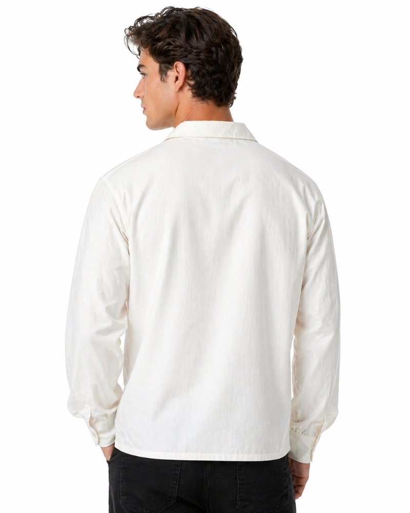 Man wearing a white long-sleeve shirt on a white background