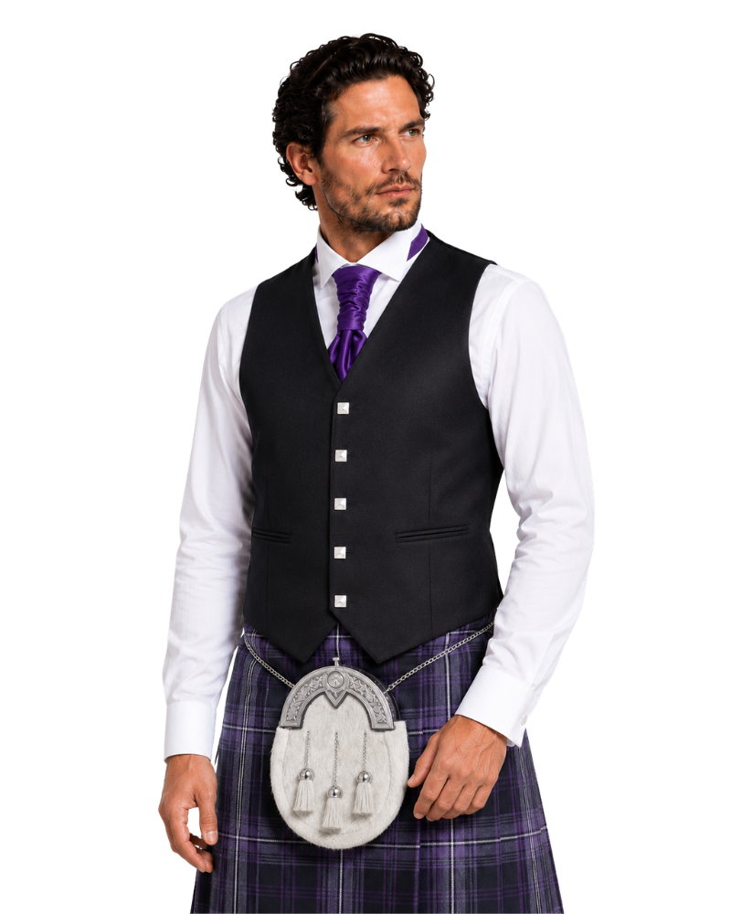 Man wearing a black waistcoat, white shirt, purple tie, and plaid kilt on a white background