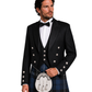 Man wearing a formal black jacket with silver buttons, white shirt, and tartan kilt on a white background