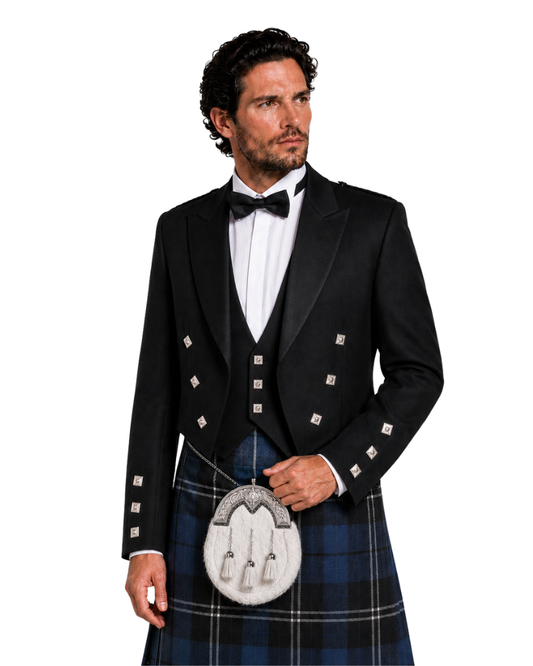 Man wearing a formal black jacket with silver buttons, white shirt, and tartan kilt on a white background