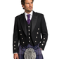 Man wearing a black Highland dress with a purple tie and tartan kilt on a white background