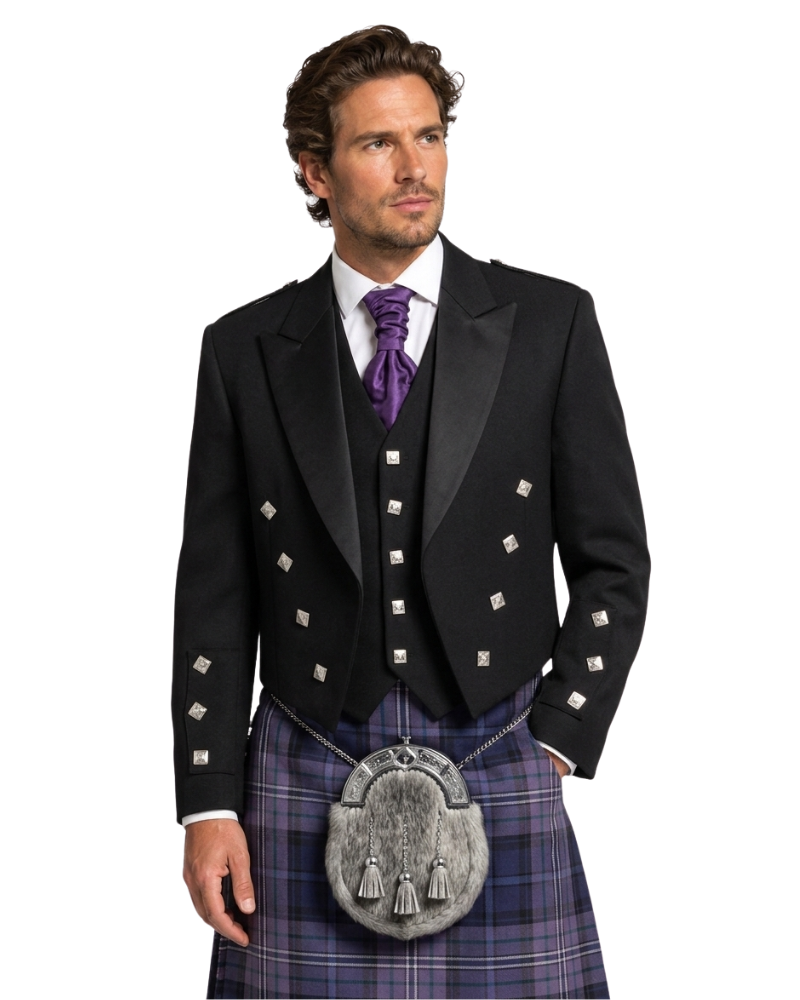 Man wearing a black Highland dress with a purple tie and tartan kilt on a white background