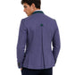 Man wearing a purple blazer with a green lapel on a white background