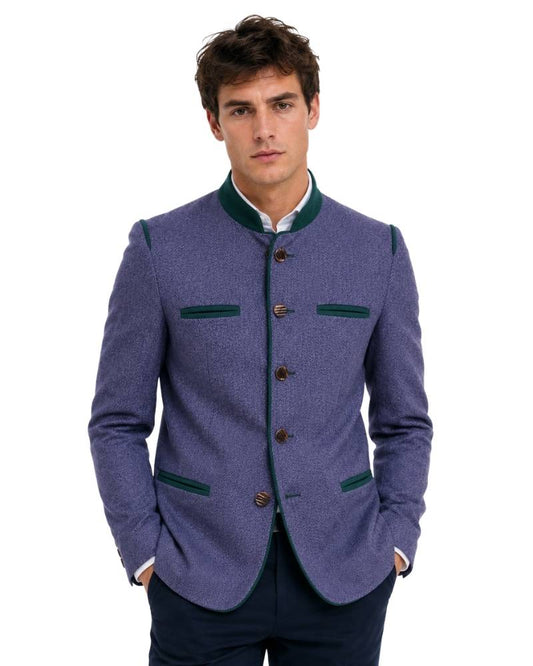 Man wearing a purple blazer with green accents on a white background